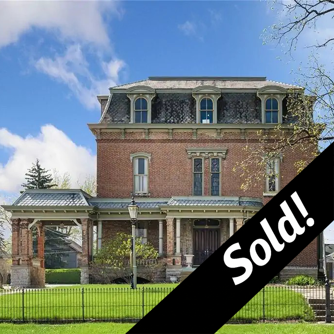 Photo of the Jones Mansion with Sold! in bottom right corner